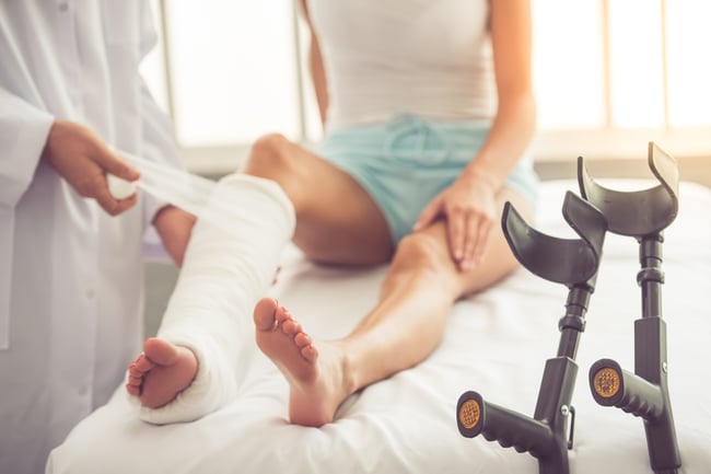 injured leg wrapped by doctor