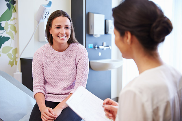 woman smiling at doctor visit