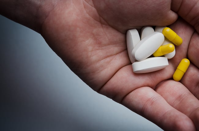 Hand full of prescription pills